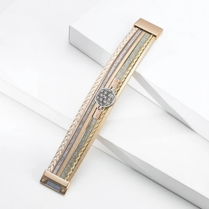 Detail of multilayer leather bracelet with tree of life charm and magnetic clasp