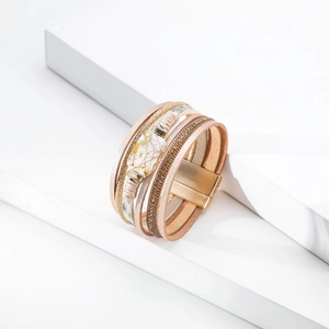 Detailed view of bohemian multilayer leather bracelet with pearl marble and magnetic clasp