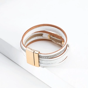 Detailed view of multilayer leather bracelet with pearls, rhinestones and magnetic buckle