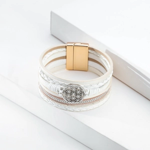 Detail of bohemian multilayer white leather bracelet with Flower of Life charm and magnetic clasp