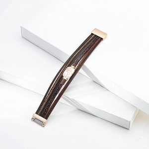 Macro shot of multi-layer leather bracelet featuring faux marble and magnetic clasp