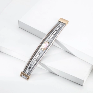 Detailed view of multilayer leather bracelet with pearl, rhinestones and magnetic clasp