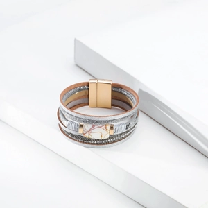 Close-up of layered bohemian leather bracelet with faux marble stone and magnetic clasp