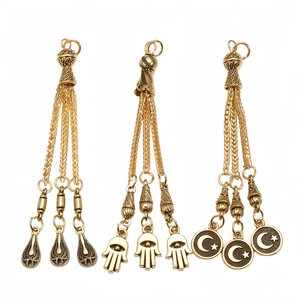 Detailed alloy long tassel pendant with Hamsa hand and star moon symbols for prayer beads