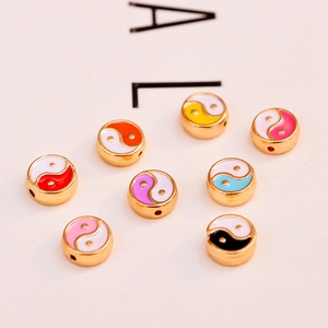 Macro shot of 10mm colorful yin yang enamel alloy beads for DIY jewelry making