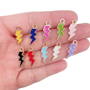 Detailed view of ten colorful enamel lightning bolt pendants for DIY jewelry making