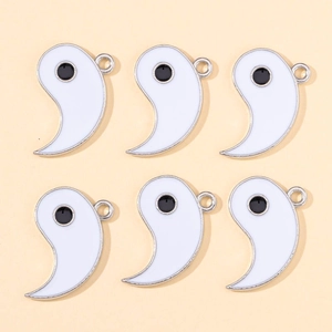 Detail of six white enamel Tai Chi Yin Yang pendants with silver edges for DIY jewelry