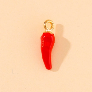 Macro shot of 3D red chili charm with gold loop for jewelry and accessory making
