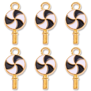 Macro detail of black and white enamel lollipop charms with gold metal edges for DIY jewelry
