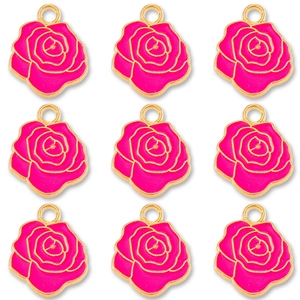 Macro shot of nine rose flower pendants in magenta enamel with golden metal edges