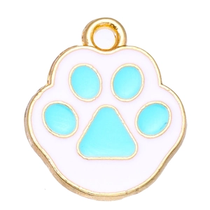 Macro view of a gold alloy cat paw pendant with white and blue enamel for DIY jewelry