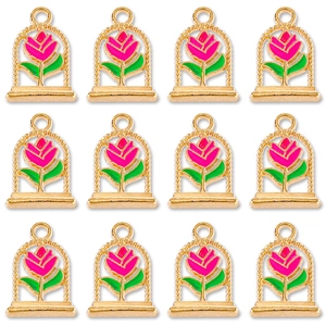 Detailed view of twelve rose pendants with gold frame and pink enamel for DIY jewelry
