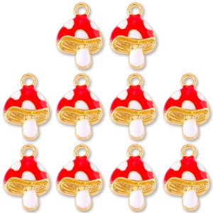Detailed set of 10 red enamel mushroom charms with gold edging for DIY jewelry making