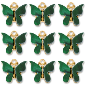 Detailed view of nine dark green butterfly pendants with golden frames in a grid layout
