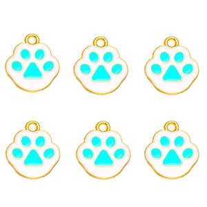 Detail of six blue and white enamel cat paw pendants with gold metal hanging loops
