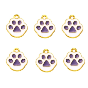 Detail view of 6-piece purple cat paw charms with gold plating for DIY jewelry making
