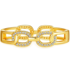 Macro shot of gold-plated hollow chain link bracelet with sparkling paved zircons
