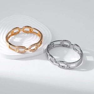 Luxe hollow spring bracelets in gold and silver with sparkling rhinestones on textured stands