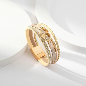 Detail of multi-layer wrap bracelet with gold double-ring hardware and magnetic buckle