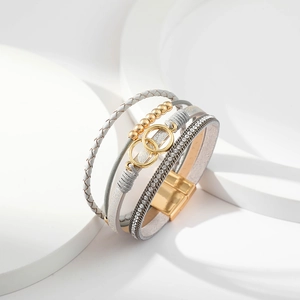 Detail of multi-layer leather bracelet featuring gold beads and sparkling crystal strands