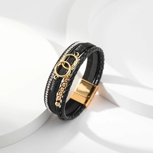 Multi-layer black leather bracelet with golden rings, crystal beads and magnetic clasp