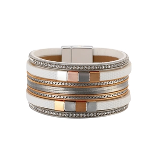 Macro view of multi-layer leather bracelet featuring rhinestone chains and magnetic closure