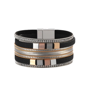 Macro detail of multi-layer leather bracelet with crystal inlay and magnetic buckle