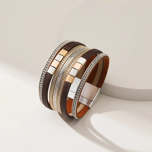 Detail of multi-layer leather wrap bracelet with rhinestones and magnetic buckle