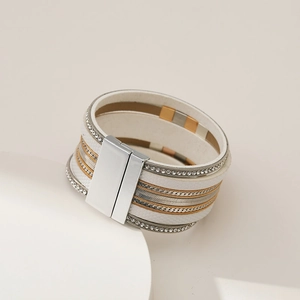 Close-up of multilayer leather bracelet with rhinestones and magnetic clasp detail