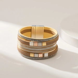 Detail of bohemian multilayer leather bracelet with magnetic clasp and rhinestones