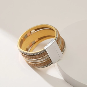 Detail view of multi-layer boho leather bracelet with sparkling rhinestones and magnetic clasp