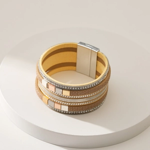 Detailed view of multilayer leather bracelet with metal cubes and magnetic buckle