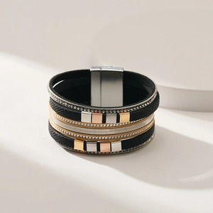 Detail of multi-layer leather bracelet featuring rhinestones and a silver magnetic clasp