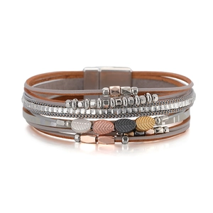 Multilayer bohemian leather bracelet with silver beads and metal leaf charm on white base