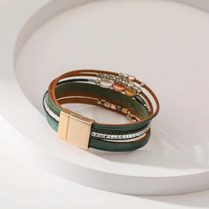 Macro detail of Bohemian multilayer leather bracelet featuring magnetic clasp and crystal beads