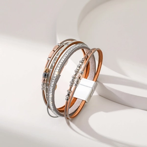 Bohemian multilayer leather bracelet with silver magnetic clasp on display stand