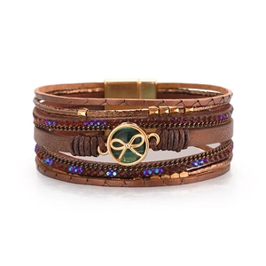 Bracciale multistrato in pelle stile boho con cristalli e chiusura a fiocco dorato