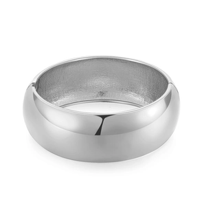 Polished silver hinged bangle with wide smooth surface and matte inner texture on white background