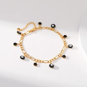Bracelet de cheville Evil Eye doré avec breloques noir et blanc sur chaîne Figaro