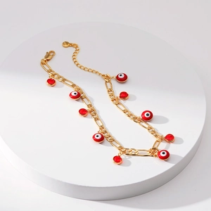 Gouden Figaro enkelbandje met rode Evil Eye emaille hangers en kristallen bedels