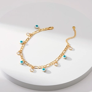 Bracelet de cheville Figaro doré avec charms œil maléfique bleus et strass
