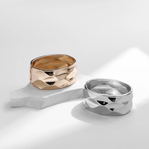 Minimalist wide cuff bracelets featuring quilted diamond pattern in gold and silver finish