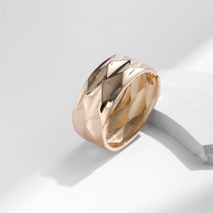 Minimalist rose gold wide cuff bracelet with geometric faceted diamond texture design