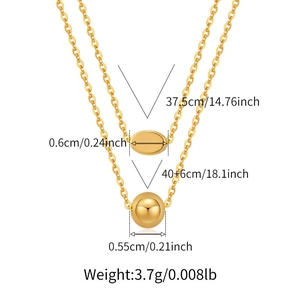 Double-layered 18K gold plated necklace with polished oval pendant and golden bead