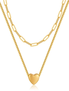 Close-up of double layer paperclip chain with polished 18K gold heart pendant
