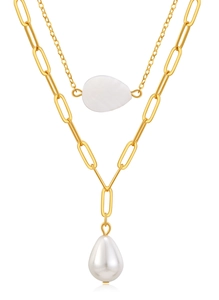 Detail view of double-layer gold chain with white shell leaf and teardrop pearl pendant