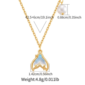 Detail of 18K gold-plated fish tail necklace with blue-white inlay and a round pearl