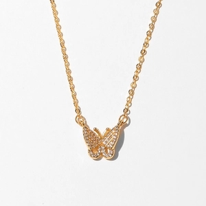 Detailed close-up of a butterfly pendant necklace featuring sparkling zircon crystals