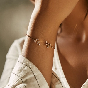 18K gold plated leaf-shaped open cuff bracelet for women featuring sparkling cubic zirconia