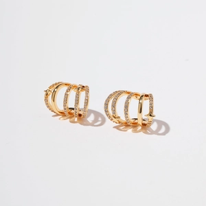 Detail of 18K gold plated multi-layer ear cuff featuring stars and pavé zircon stones